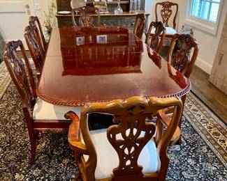 Now $1500 - Was $3000 Carved Chippendale-style Mahogany dining table with 10 carved chairs                                                                                               table: 77" long plus two 18.5" leaves = total length 114"              