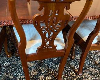 Now $1500 - Was $3000 Carved Chippendale-style Mahogany dining table with 10 carved chairs                                                                                               table: 77" long plus two 18.5" leaves = total length 114"                           