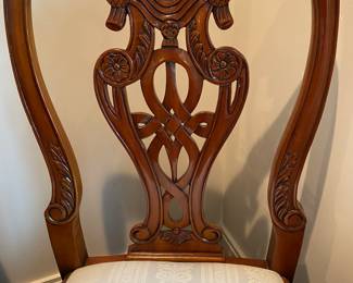 Now $1500 - Was $3000 Carved Chippendale-style Mahogany dining table with 10 carved chairs                                                                                               table: 77" long plus two 18.5" leaves = total length 114"                             