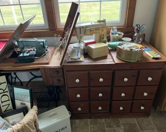 Sewing machine table with chair pushed in. 