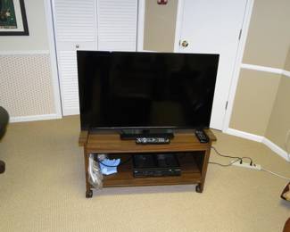 Rolling cart and large flat screen TV also is for sale