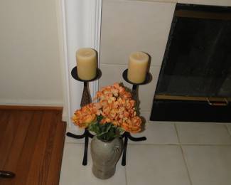 Metal candlesticks, and pottery blend right together
