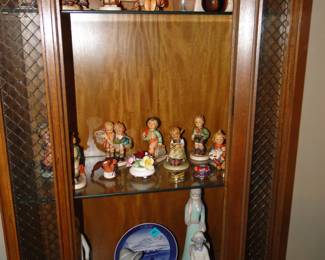 Hummels and Ilardo figurines, the lighted cabinet is also for sale too