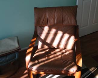 Relax in this leather and wood, Danish inspired chair