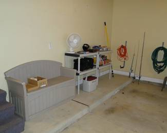 Storage bench, shelving units, and other fun things located in the garage
