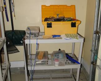 The garage holds tools and yard equipment too