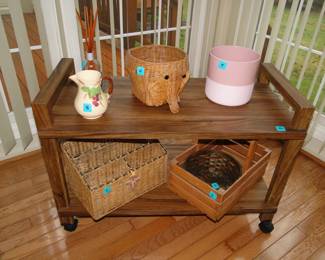 nice two-tiered rolling cart with some very nice decorative elements on it