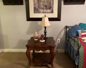 End table.  This lamp is part of a matching set.  Check out that great wall art.