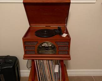 Check out this record player.  Vintage stand sold separately.  Small record collection.