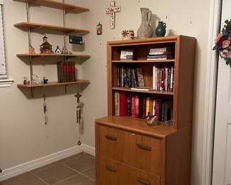 File cabinet.  This unit works great.  There is a second file cabinet and shelf unit and the bottom of the top file cabinet drawer needs a little love (as in glued back in place).