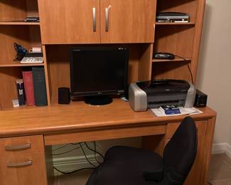 Desk, chair, computer, printer, and more in the office.