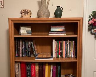 Great collection of books and decor items.