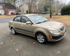2006 Kia Rio LX
124191 miles
New battery, oil change, good tires, etc. 
has been reliable for us. 
Rebuilt transmission.