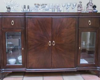 Contemporary buffet w/3 drawers, brass pulls, 4 cupboards with glass and wood shelves.  It lights up!  Dark Walnut stained pattern matched veneer.  Side storage cupboards (39"h x 61"w x 24"d):  $400.00