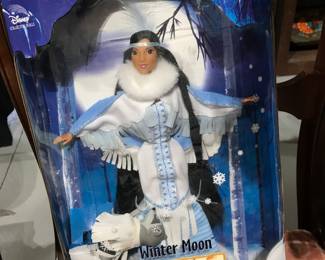 Several unopened Barbies and Pocahontas 