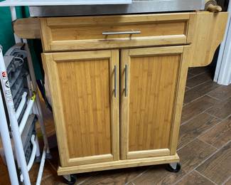 Rolling center island with storage