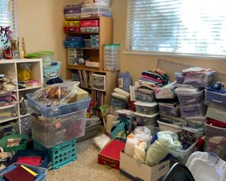 Craft Room full of material, threads, Vintage patterns by McCall, Simplicity and more