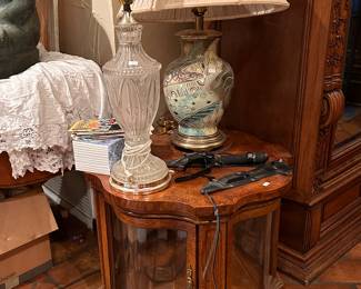 Knives, lighted curio table, lamps 