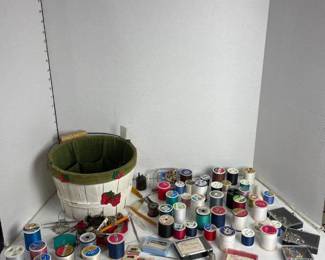 Sewing baskets with sewing items (thread and more)