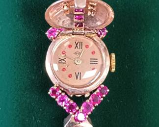 14k Pery rose gold watch with Rubies and diamonds.
Medium wrist. Works!