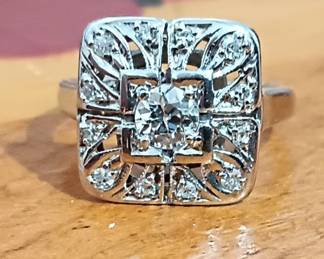 Stunning Antique diamond ring with
0.40 ct tw center stone and diamond accents around the setting 