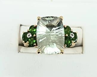 Green amethyst stones with interesting cut and chrome diopside accent stones. 
Sz 5-3/4