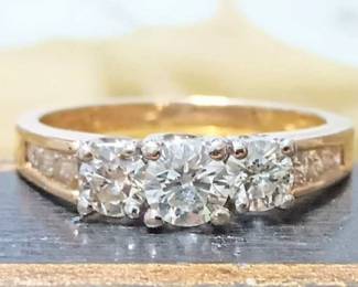 3 diamond ring with diamonds on the sides of the band
