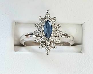 Sapphire and diamond ring in 14k white gold. 0.20 ct tw in diamonds approx sz 6.5