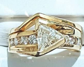 Trillion cut diamond in a modern yellow gold setting