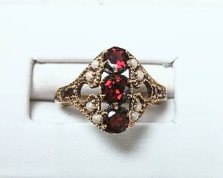 Antique garnet ring in 10k with seed pearls
Sz 6.5