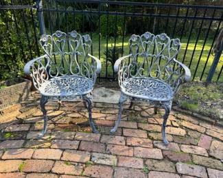 63	$90 	Two aluminium chairs floral									