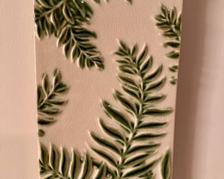 One of three ceramic leaf wall decor.