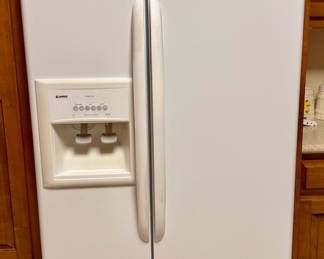 Sear Kenmore side-by-side refrigerator freezer.