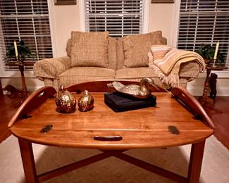 LazyBoy love seat behind an Ethan Allen tray table and between two Ethan Allen plant stands.
