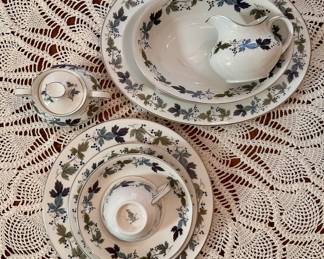 Royal Doulton "Burgundy" pattern English translucent china.  Eight 5-piece settings plus platter, two vegetable bowls, lidded sugar and creamer.