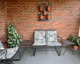 Wrought iron mesh outdoor furniture: gliders, tables and chairs.