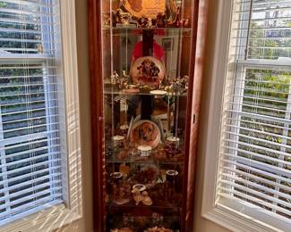 Howard Miller lighted corner curio.  Lots of dachshund figurines and collectable plates.