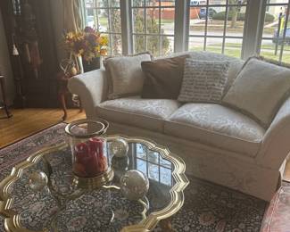 LaBarge brass and glass cocktail table and creme color fabric custom sofa (custom made - Walter Smithe)