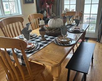 Oak country style table with 1 leaf 4 regular chairs and or 2 arm chairs (not shown here) and or black wood bench (sold separately) 