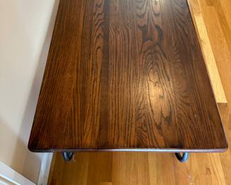 M12 - $65. Coffee Table - wooden top & Metal base. Measures 