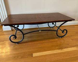 M12 - $65. Coffee Table - wooden top & Metal base. Measures 