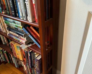 M89 - $20 Folding bookcase. Hard cover books $2. Soft cover $1