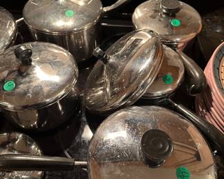 M151 - Stainless pans with lids $4 - $8. Right is Revere Ware