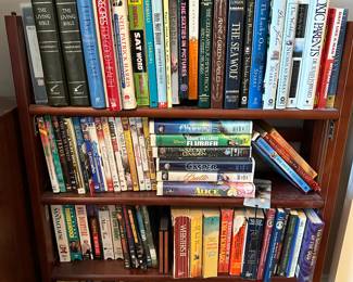 M89 - PENDING $20 Folding bookcase. Hard cover books $2. Soft cover $1