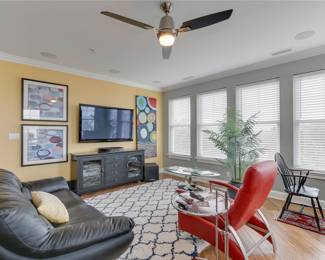 ONLY available in this photo: Samsung 55" TV, Italian Natuzzi leather black couch and Nourison rug