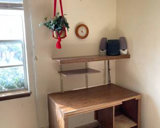 Corner desk with shelves on a wall grid 