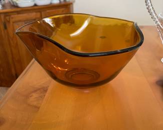 Amber glass serving bowl with asymmetrical edges. Really beautiful piece! 