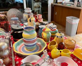 Pretty pottery for the kitchen, vintage Amish buttermilk Pyrex, silver over copper creamer/ pitcher, and many unique pieces collected from around the globe.