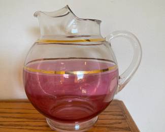 Cranberry kool-aide style pitcher with gold rims