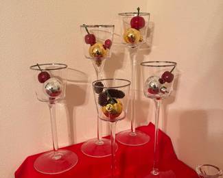 Set of five staggered height clear glass goblets with thin silver band on the rim. Great for festive holiday decorating! (or delight your friends at the dinner table with asymmetrical height aperitif glasses! Get creative!) 